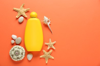 Bottle of suntan cream and seashells on orange background, flat lay. Space for text