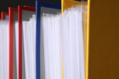 Colorful binder office folders as background, closeup