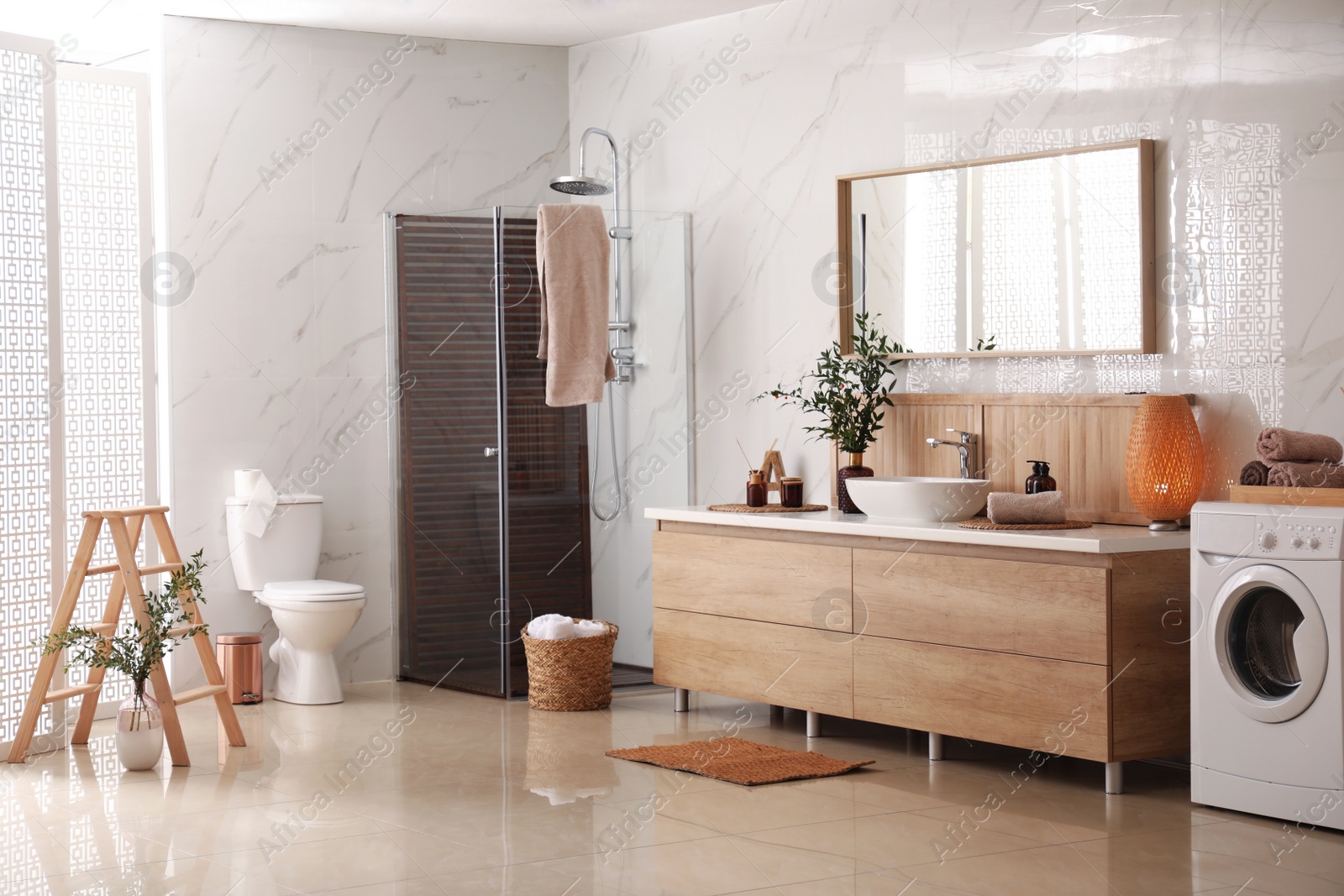 Photo of Modern bathroom interior with stylish mirror and vessel sink