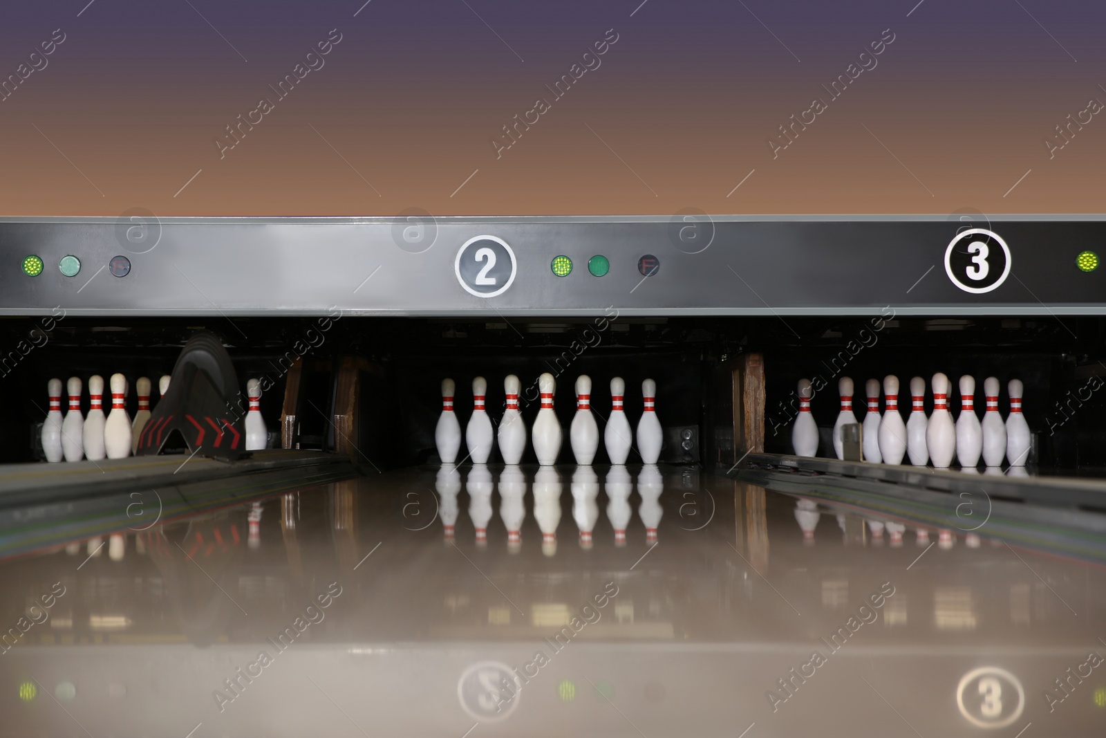 Photo of Bowling alley lanes with pins in club
