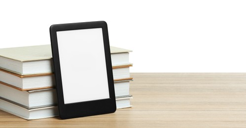 Photo of Stack of hardcover books and modern e-book on wooden table against white background. Space for text