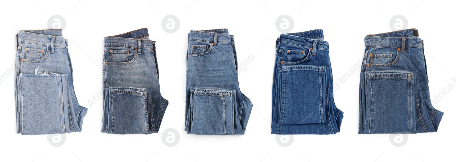 Image of Set with different jeans on white background, top view