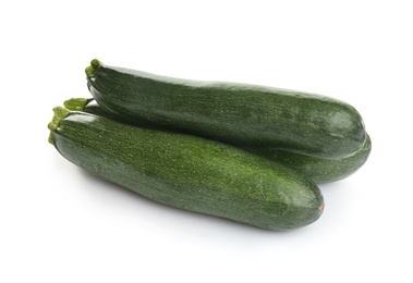 Photo of Fresh ripe green zucchinis isolated on white