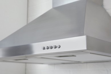 Modern range hood in kitchen, closeup view