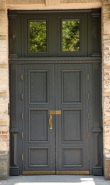 Photo of Building with vintage wooden door. Exterior design