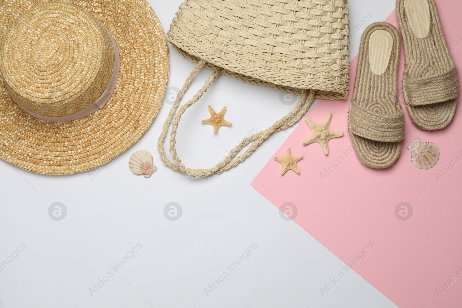 Photo of Stylish bag and beach accessories on color background, flat lay. Space for text