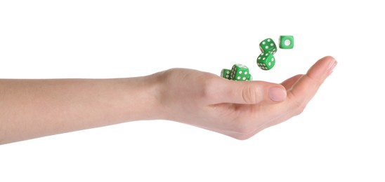 Photo of Woman throwing game dices on white background, closeup