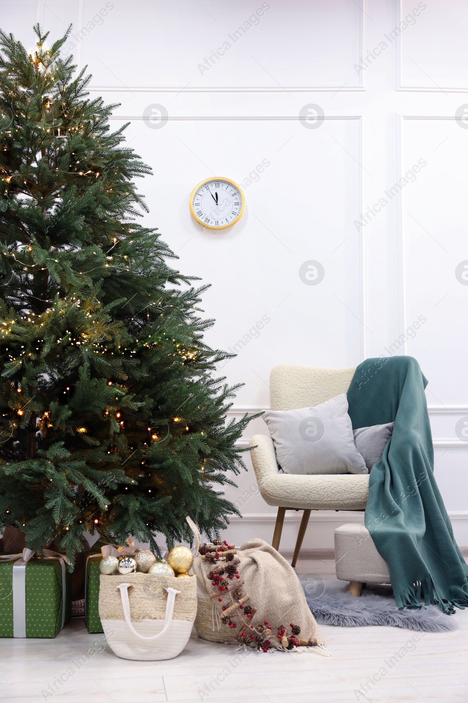 Photo of Many different gift boxes under Christmas tree indoors