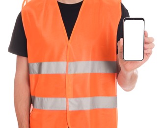 Male industrial engineer in uniform with phone on white background, closeup