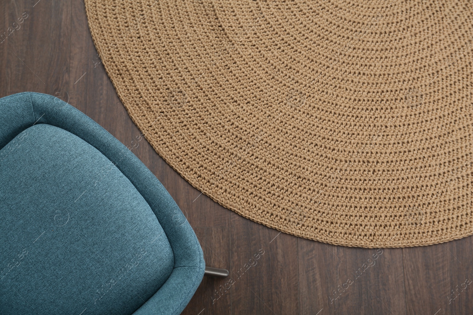 Photo of Stylish light blue chair on floor, top view. Space for text