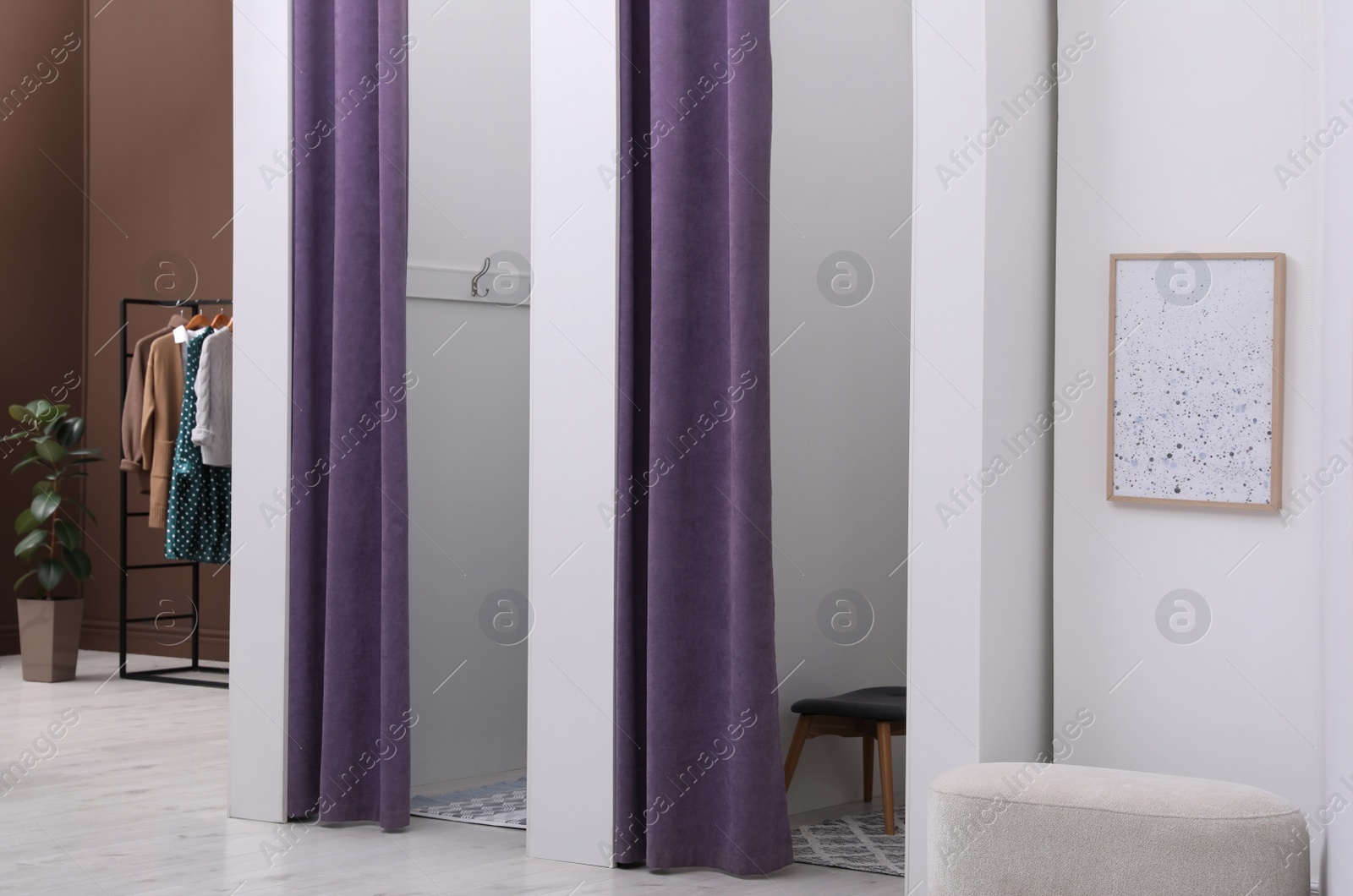 Photo of Empty dressing rooms in fashion store. Stylish interior