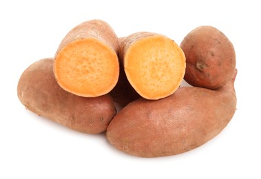 Whole and cut sweet potatoes on white background