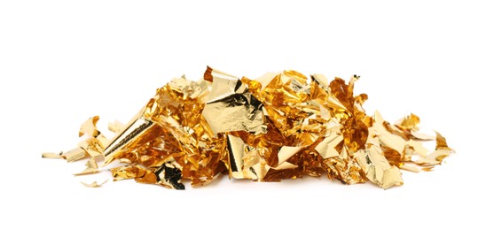 Pile of edible gold leaf on white background