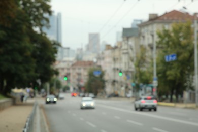 Photo of Blurred view of quiet street with beautiful buildings, road and trees