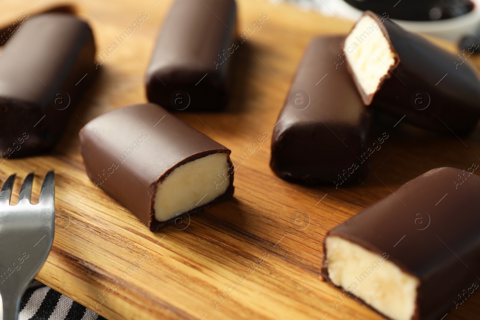 Photo of Glazed curd cheese bars on table, closeup