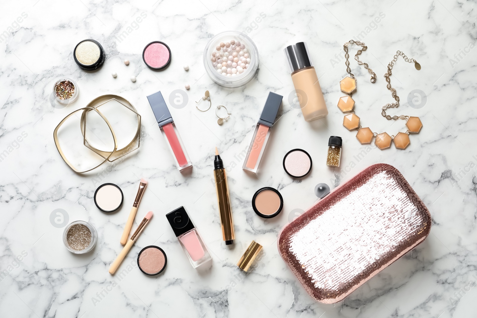 Photo of Beautiful composition with lipsticks and bijouterie on light background, flat lay