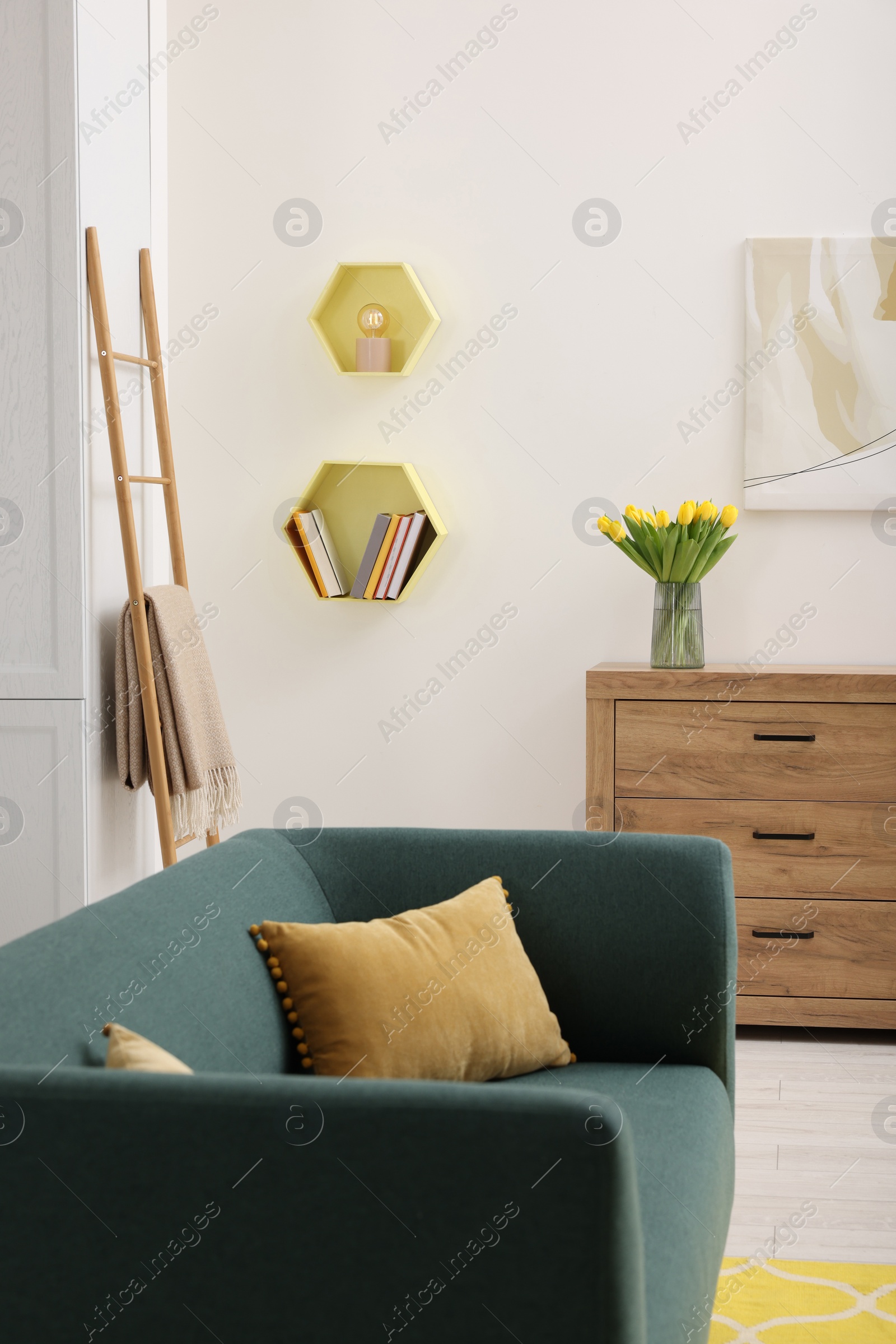 Photo of Spring interior. Stylish room with comfortable furniture