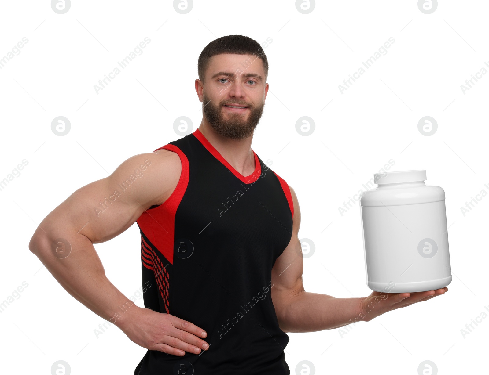 Photo of Young man with muscular body holding jar of protein powder on white background