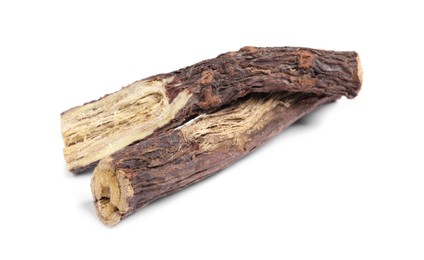 Photo of Dried sticks of liquorice root on white background