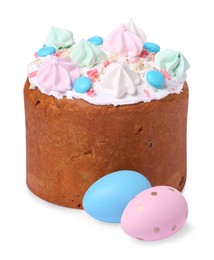 Photo of Traditional Easter cake with meringues and painted eggs isolated on white