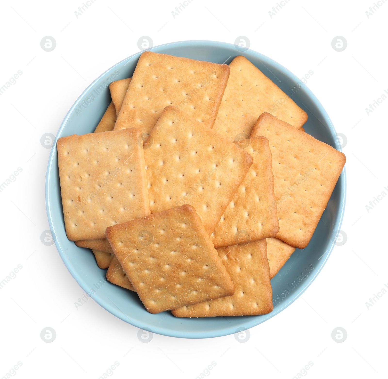 Photo of Tasty crackers in bowl isolated on white, top view