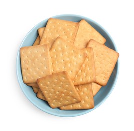 Tasty crackers in bowl isolated on white, top view