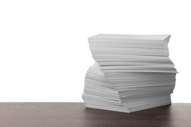 Stack of paper sheets on wooden table against white background. Space for text