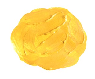 Yellow paint circle drawn with brush on white background, top view