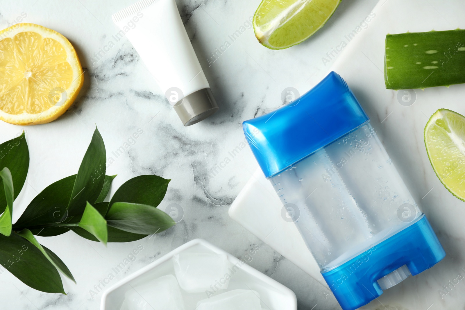 Photo of Flat lay composition with natural gel deodorant on white marble table