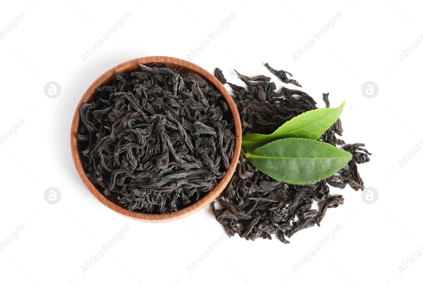 Photo of Dry and fresh tea leaves isolated on white, top view