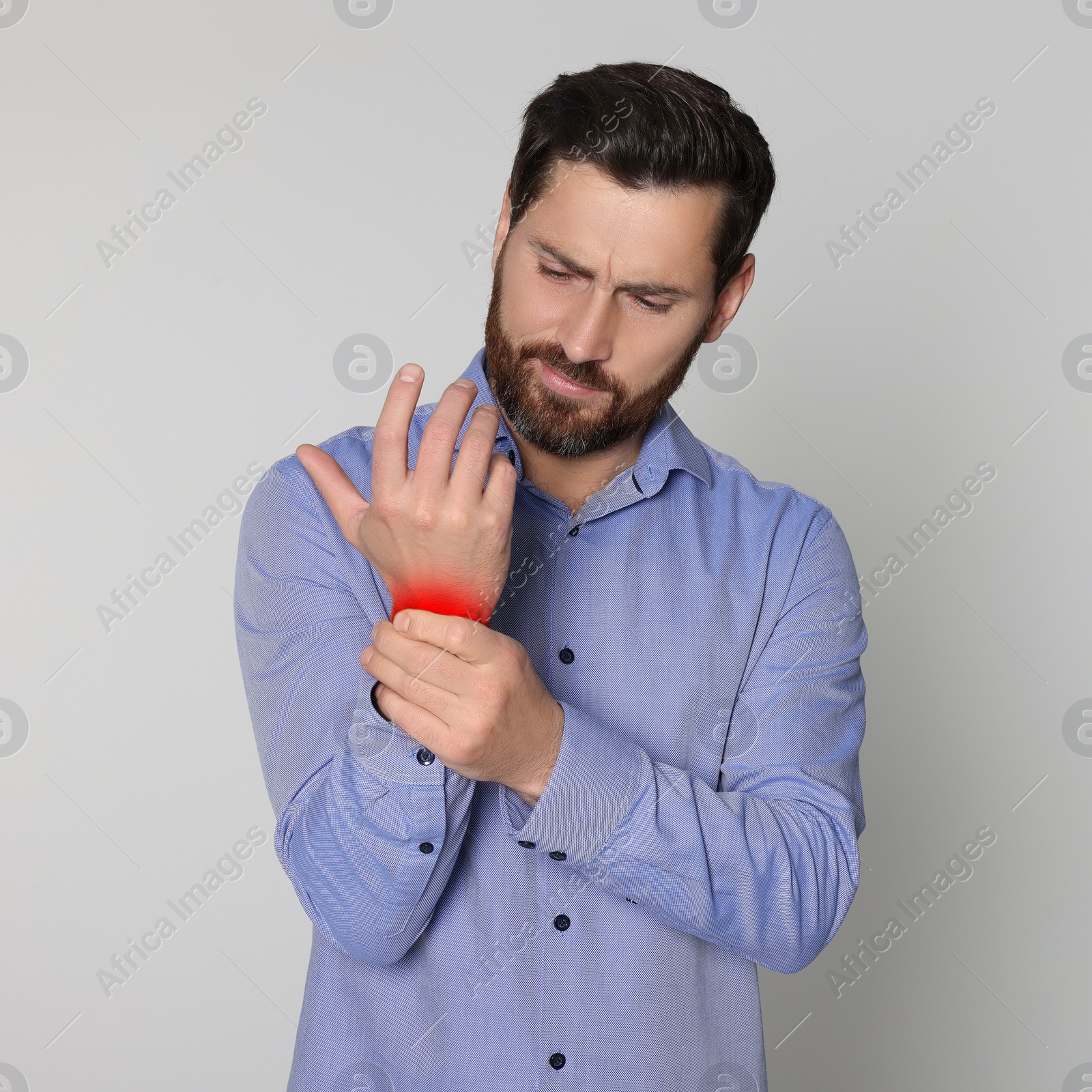 Image of Man suffering from rheumatism on light background