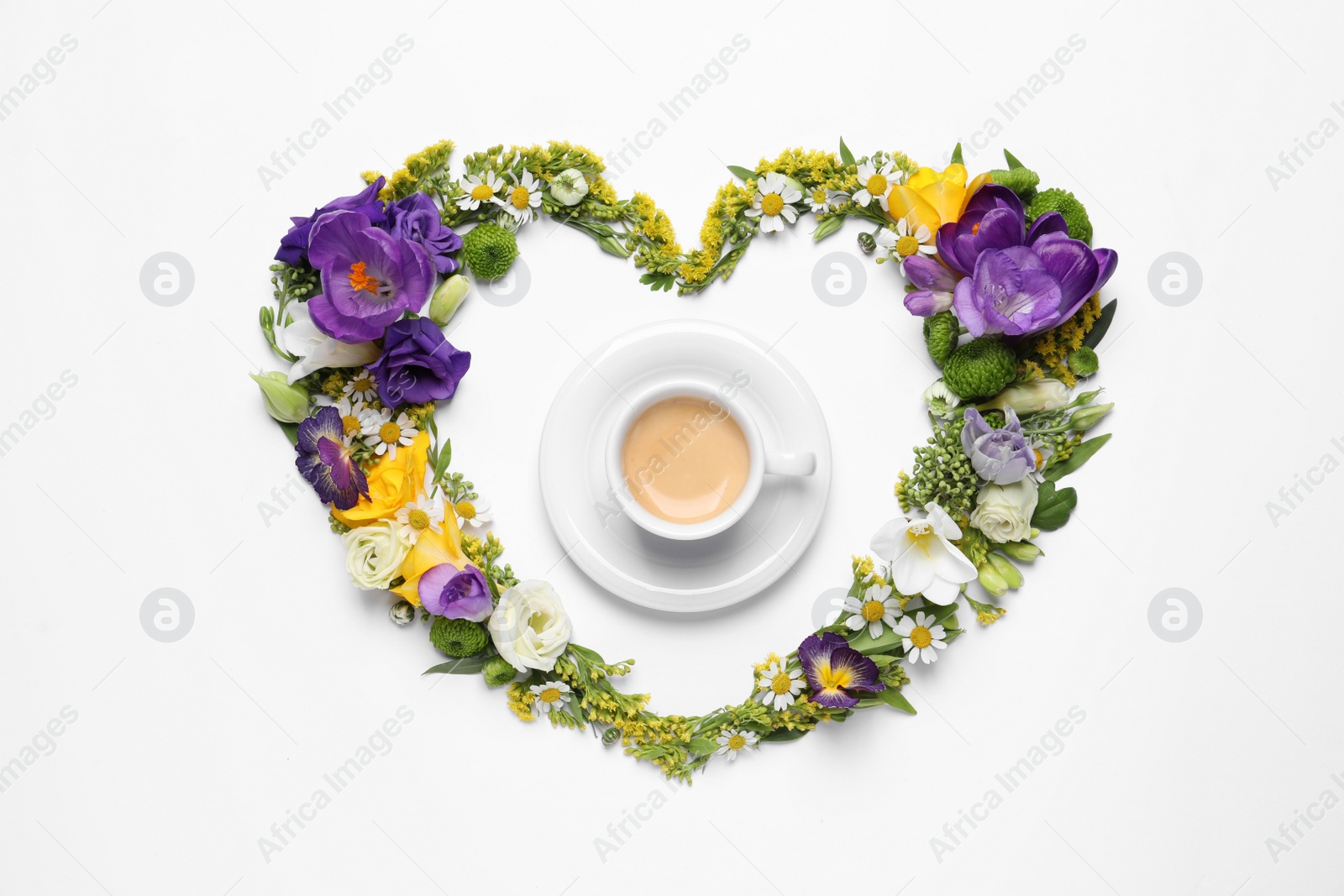 Photo of Beautiful heart made of different flowers and coffee on white background, top view