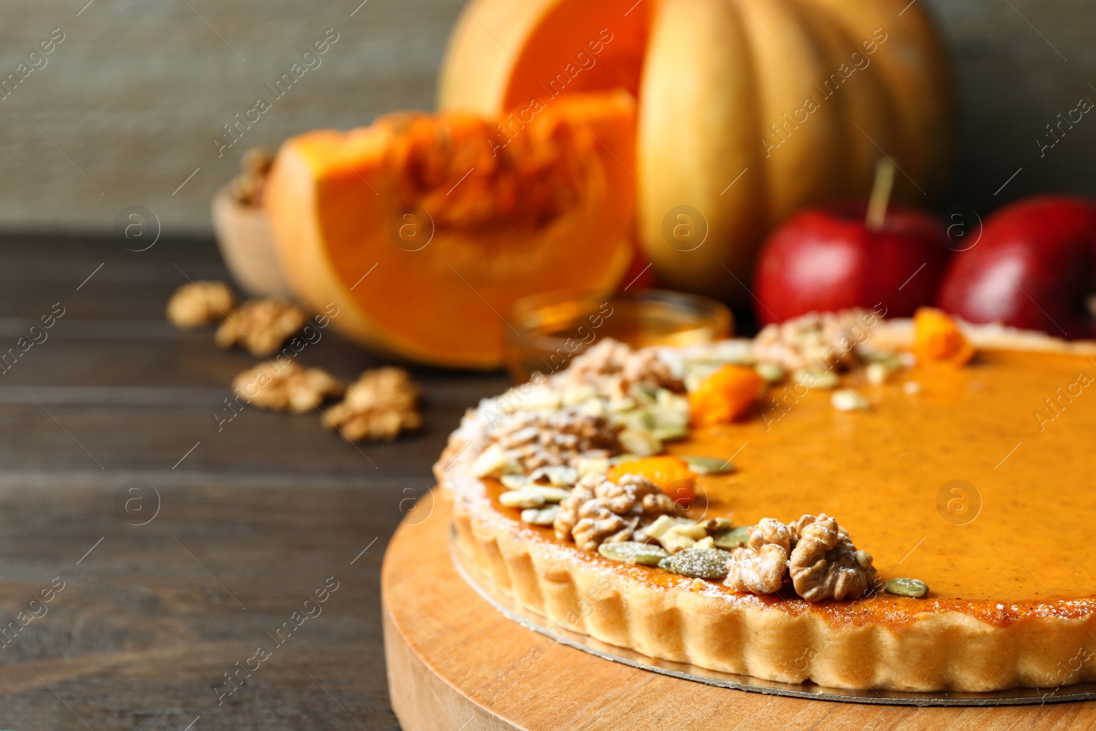 Photo of Delicious fresh homemade pumpkin pie on wooden table, closeup