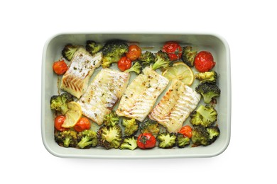 Photo of Pieces of delicious baked cod with vegetables, lemon and spices in dish isolated on white, top view