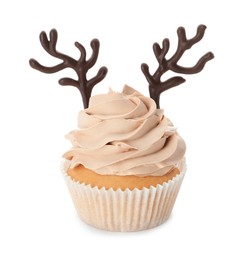 Photo of Delicious Christmas cupcake with chocolate reindeer antlers isolated on white