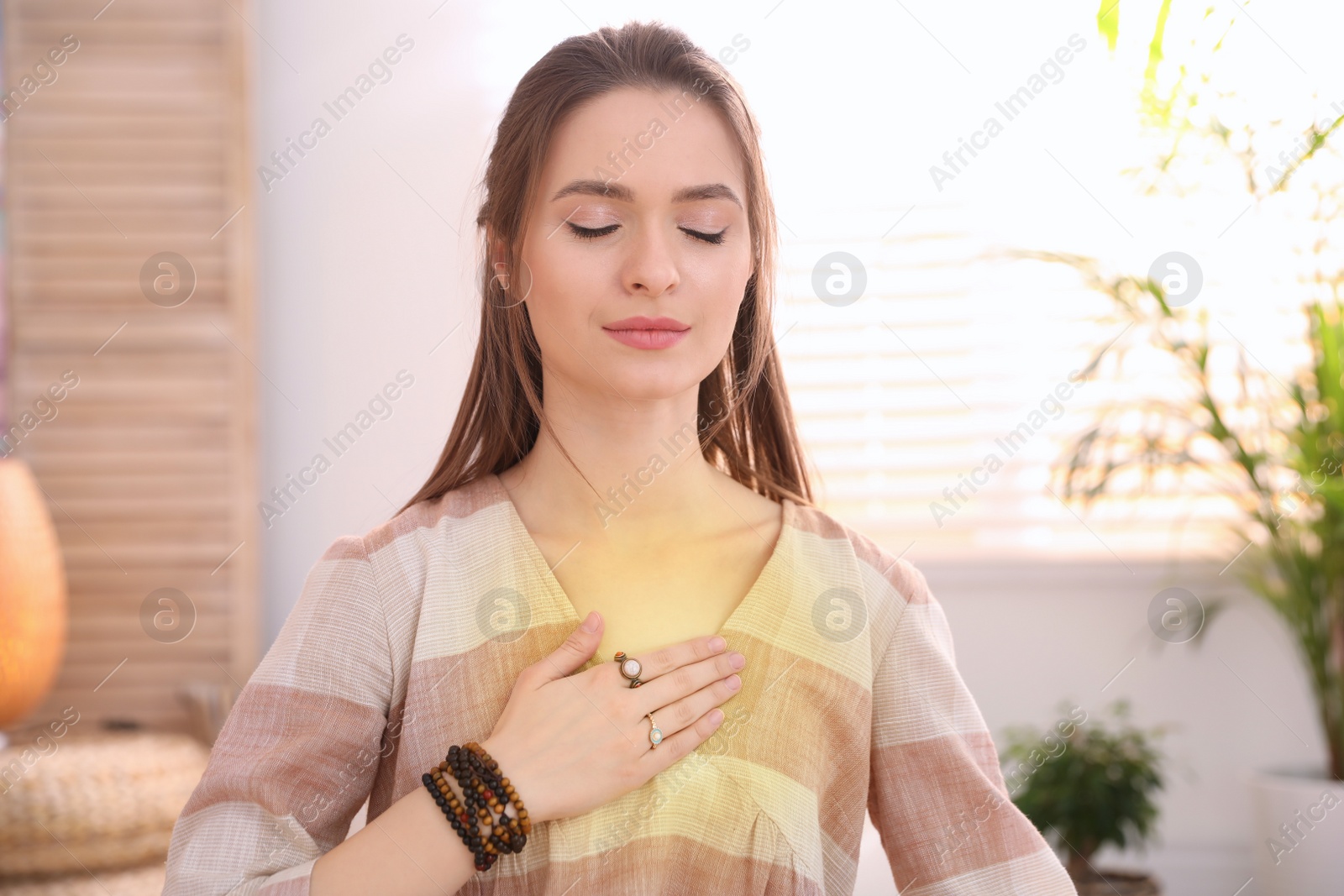 Photo of Young woman during self-healing session in therapy room
