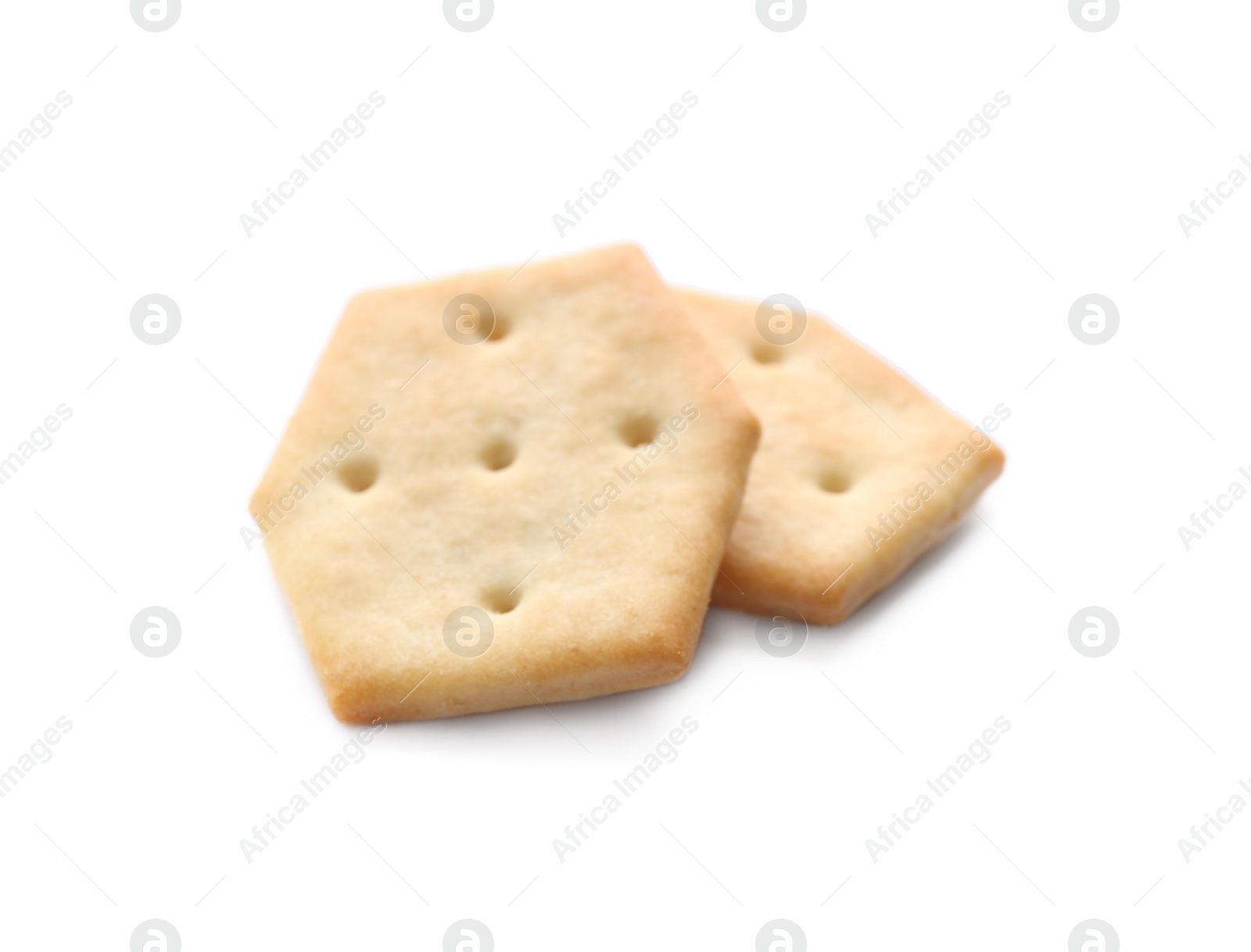 Photo of Crispy crackers isolated on white. Delicious snack