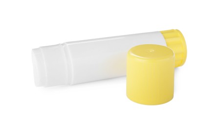 Photo of Open blank glue stick with yellow cap on white background