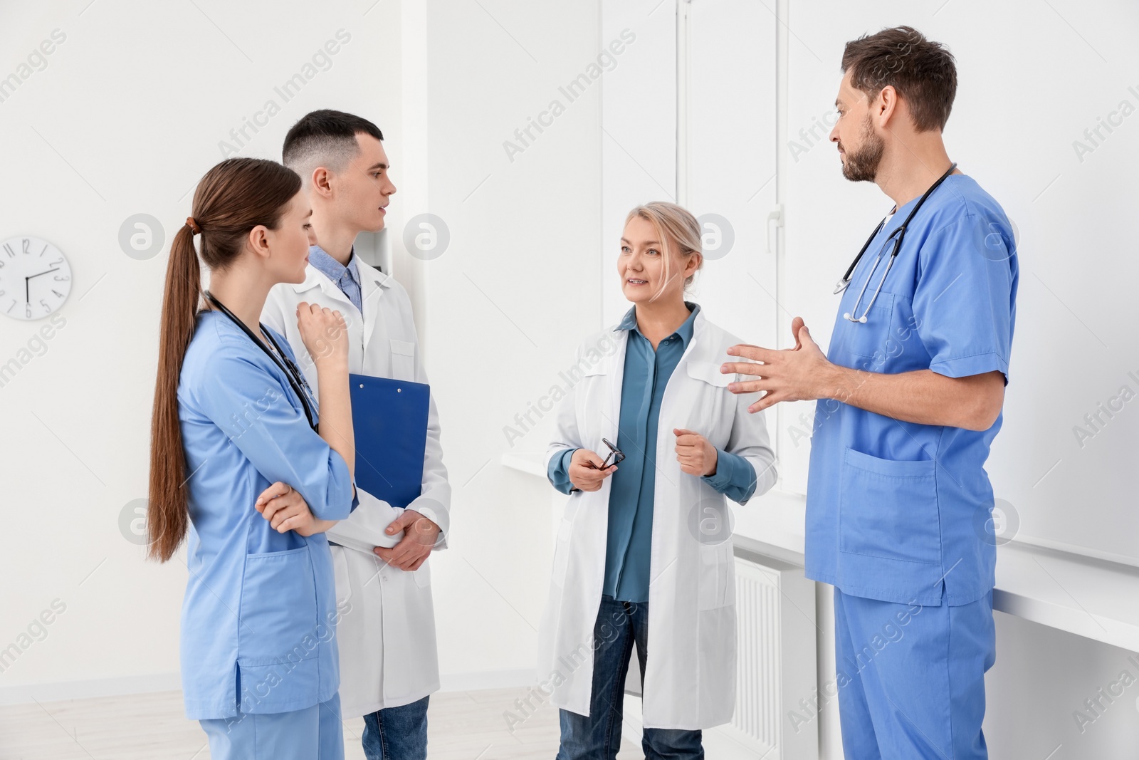 Photo of Team of doctors having discussion in clinic