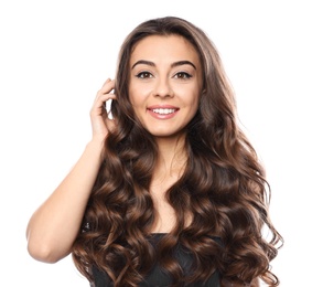 Beautiful woman with shiny wavy hair on white background