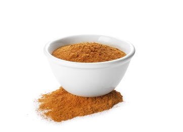 Bowl with aromatic cinnamon powder on white background