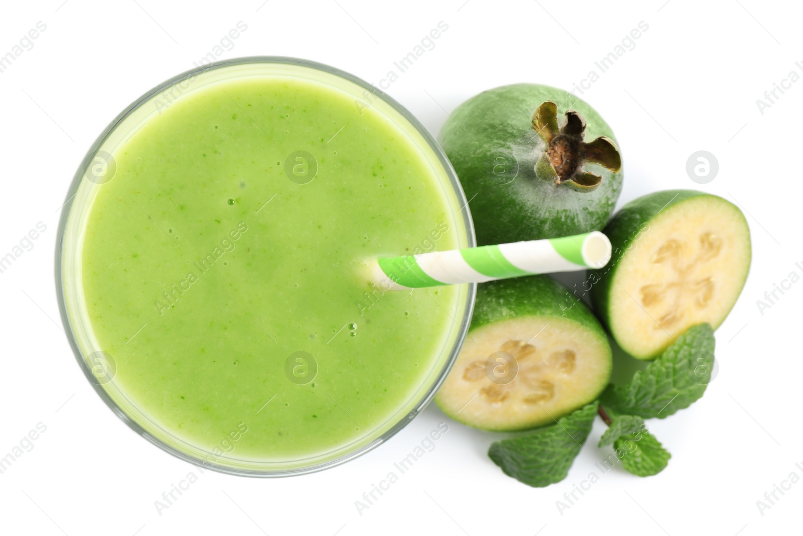 Photo of Fresh feijoa smoothie in glass and fresh fruits on white background, top view