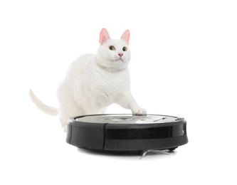 Modern robotic vacuum cleaner and cute cat on white background