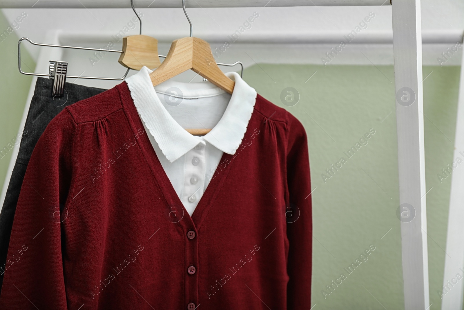 Photo of School uniform for girl on hangers, closeup