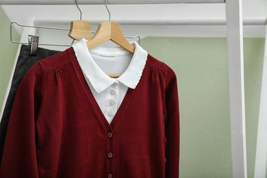 School uniform for girl on hangers, closeup