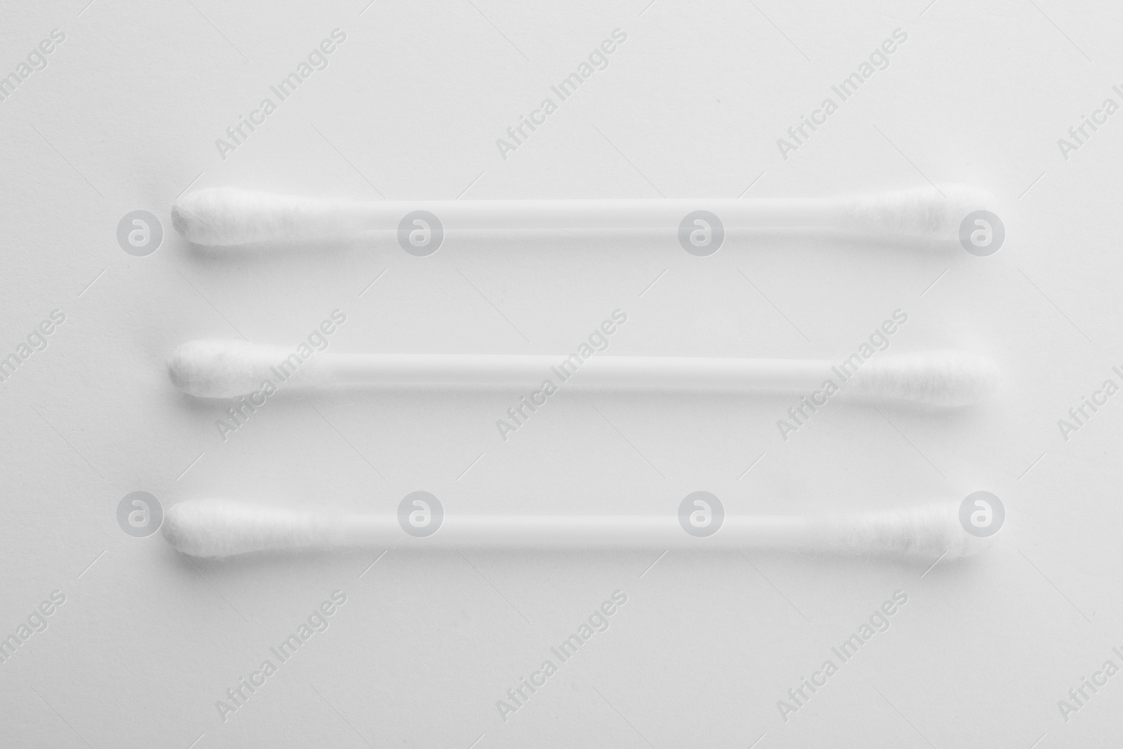 Photo of Plastic cotton swabs on white background, top view