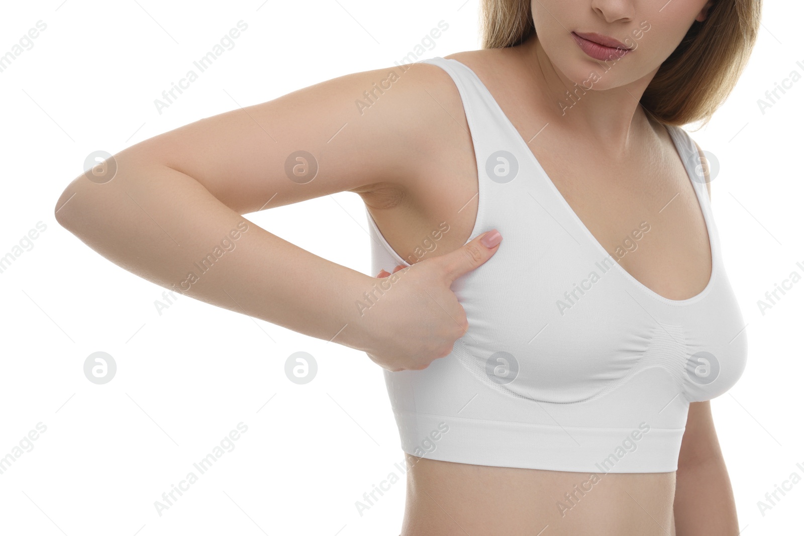 Photo of Mammology. Young woman doing breast self-examination on white background, closeup