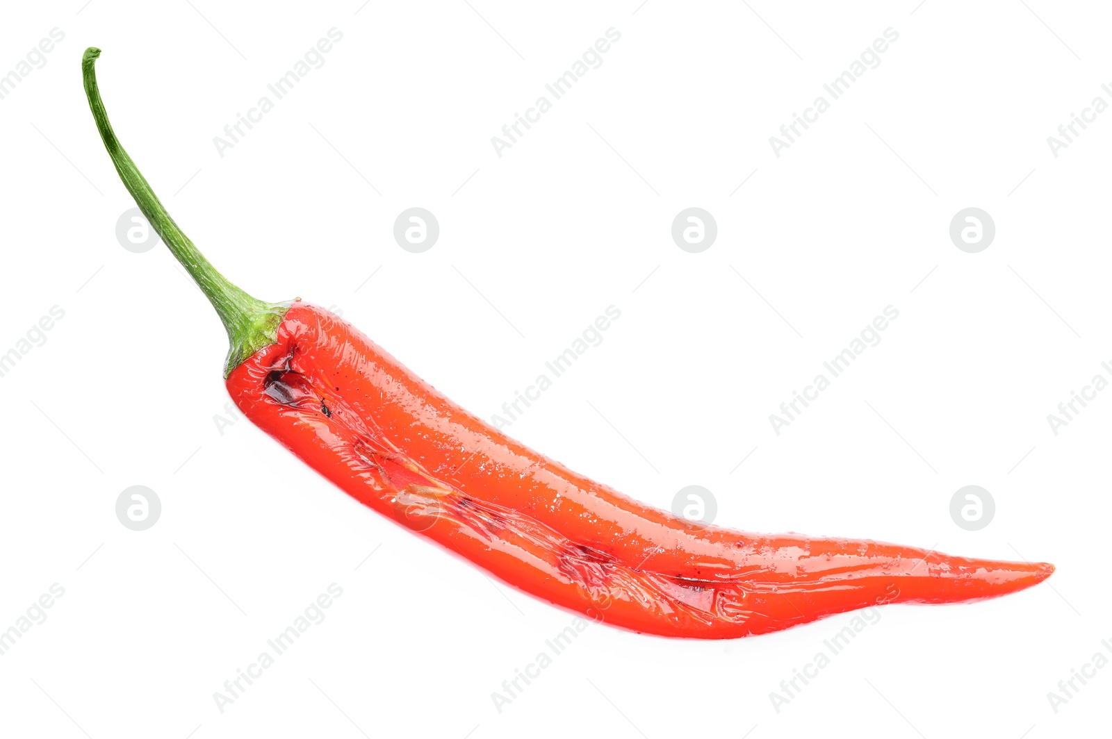 Photo of One grilled chili pepper isolated on white, top view