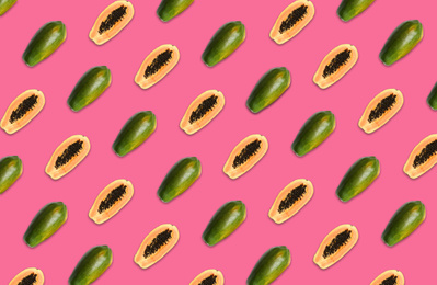 Image of Pattern of whole and halved papaya fruits on pink background