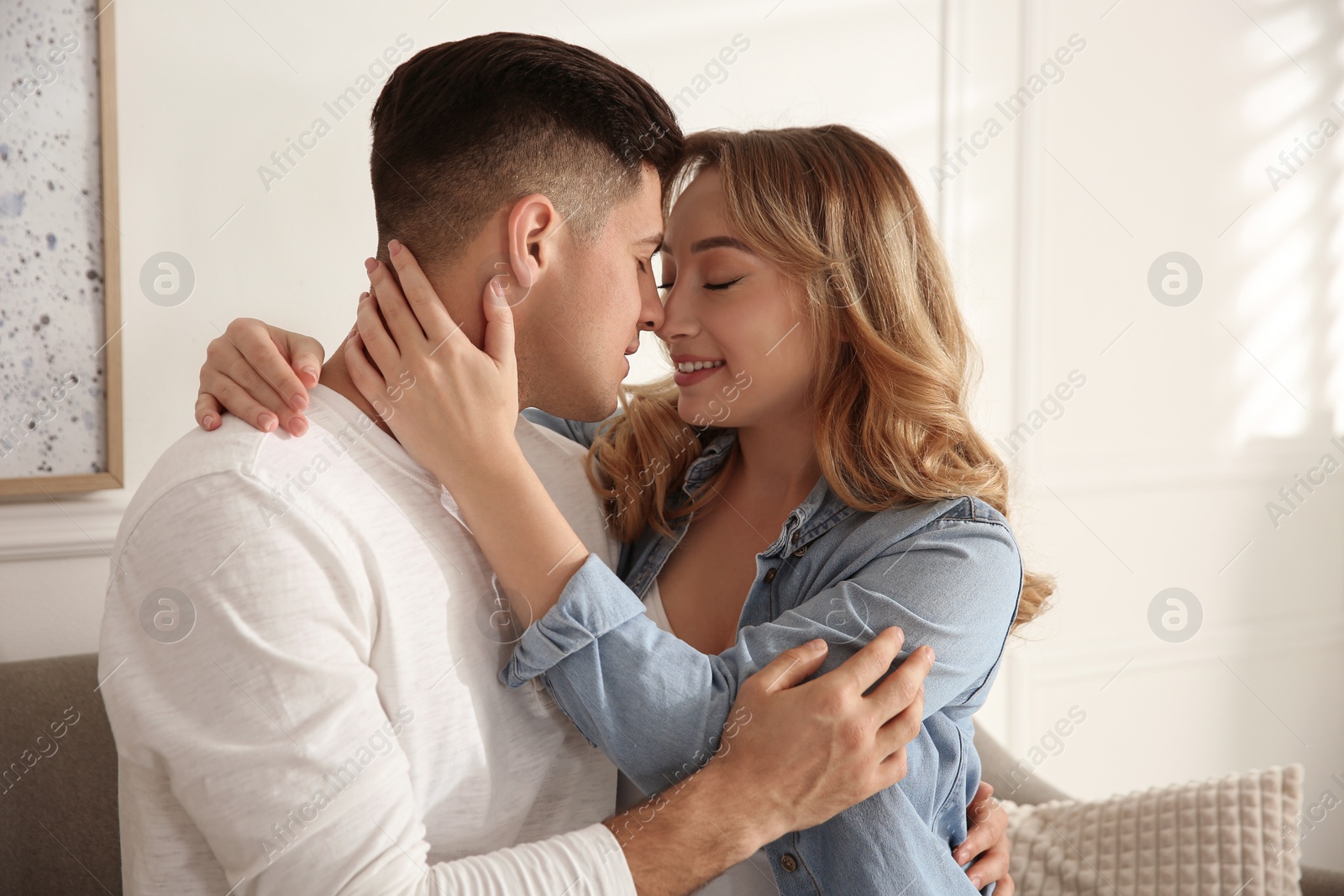 Photo of Lovely couple enjoying time together at home